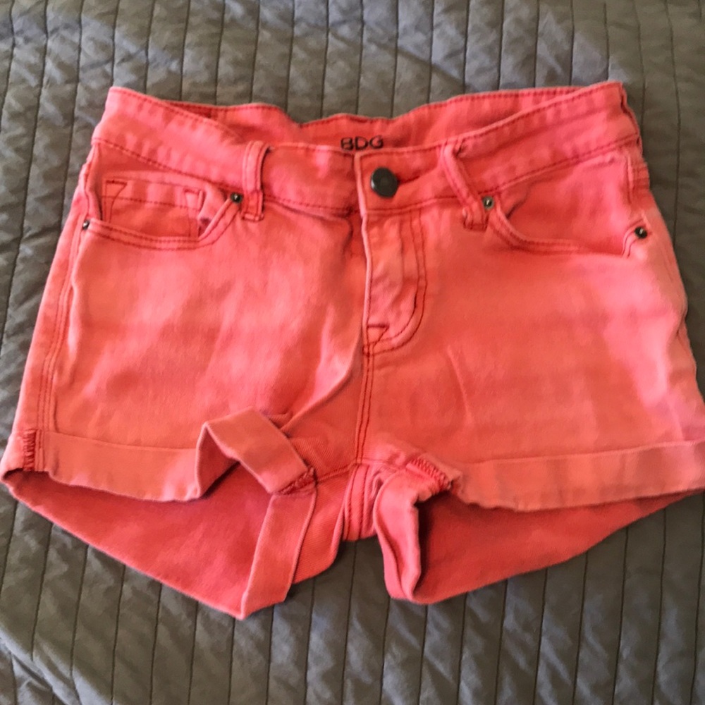 Urban Outfitters denim shorts in terra-cotta red.
